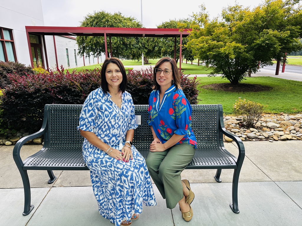 Instructional coaches on a bench.