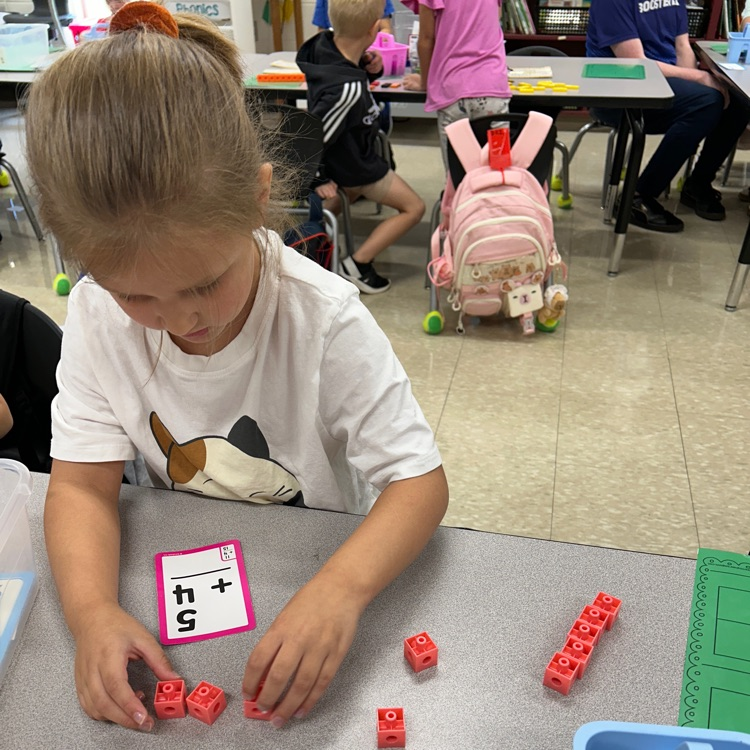 girl with math manipulative