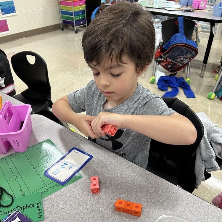 boy with math manipulative