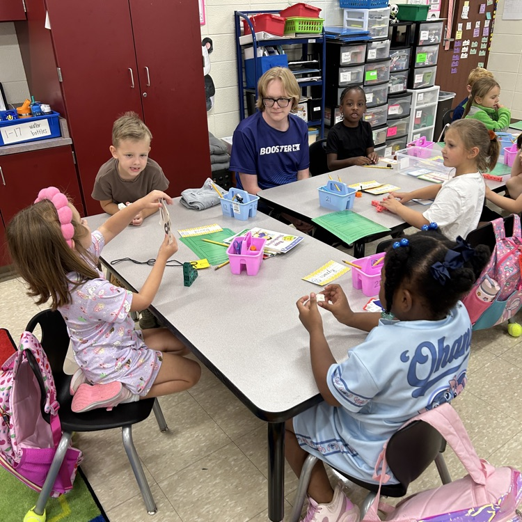 students and Brandon with math manipulatives