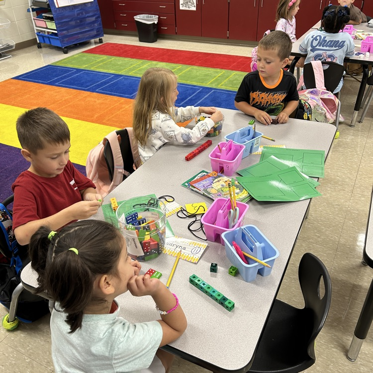 Students with math manipulatives
