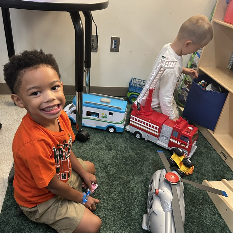 Boys and toy trucks.
