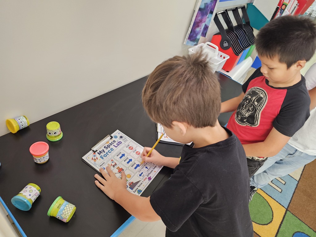 Students working on space activity. 