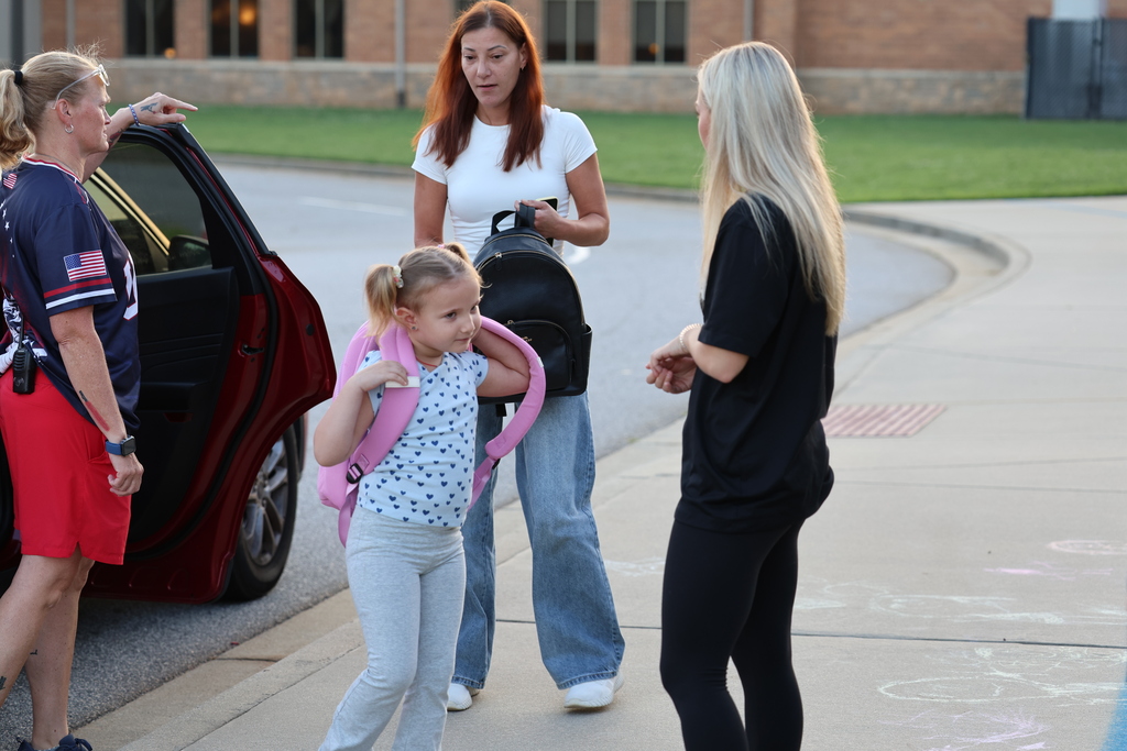 Boiling Springs Volley players help out at car duty. 
