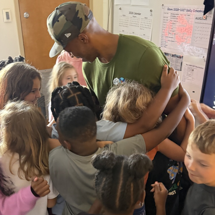 Stan Tucker with students and teachers.