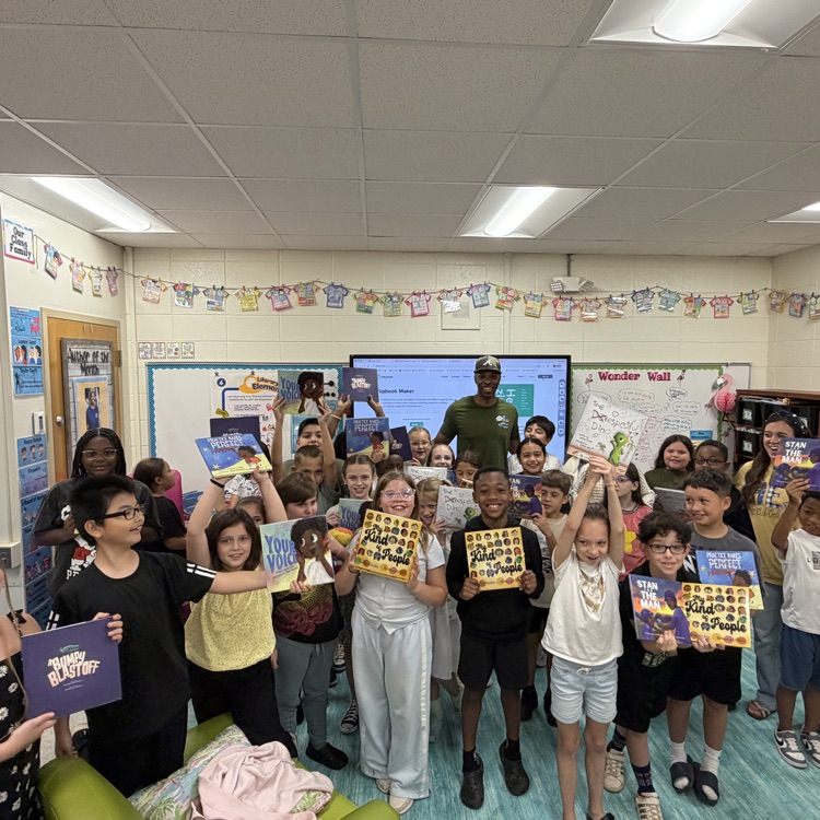Stan Tucker with students and teachers.