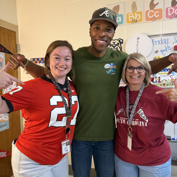 Stan Tucker with students and teachers.