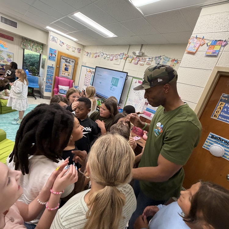 Stan Tucker with students and teachers.