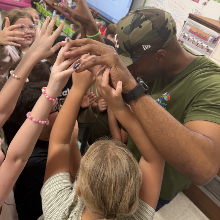 Stan Tucker with students and teachers.