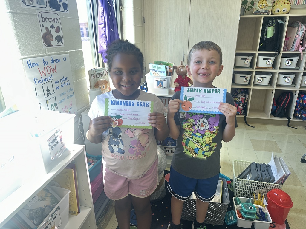 Students celebrating their hard work in stations. 