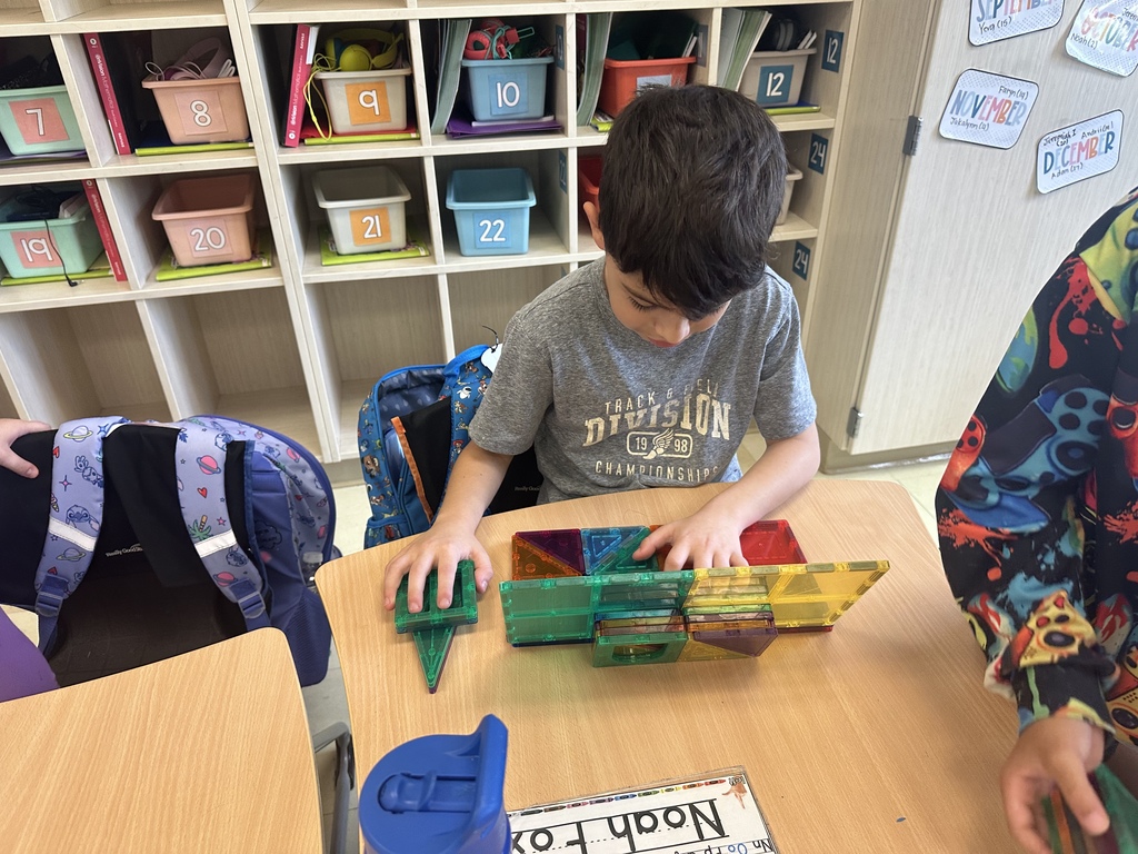 Students celebrating their hard work in stations. 