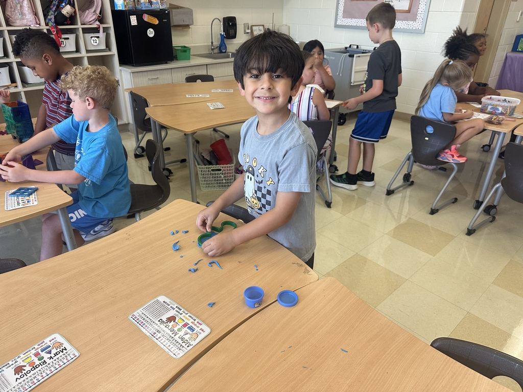 Students celebrating their hard work in stations. 