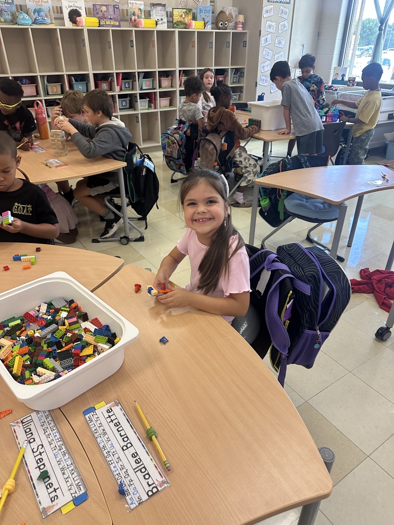 Students celebrating their hard work in stations. 