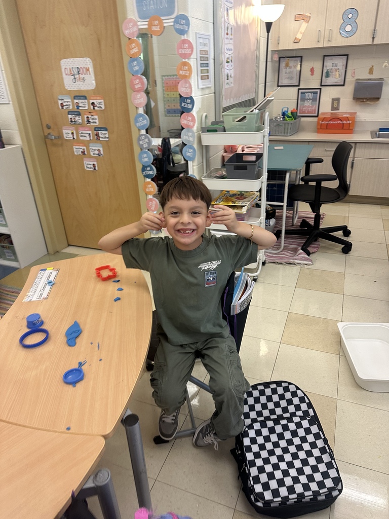 Students celebrating their hard work in stations. 