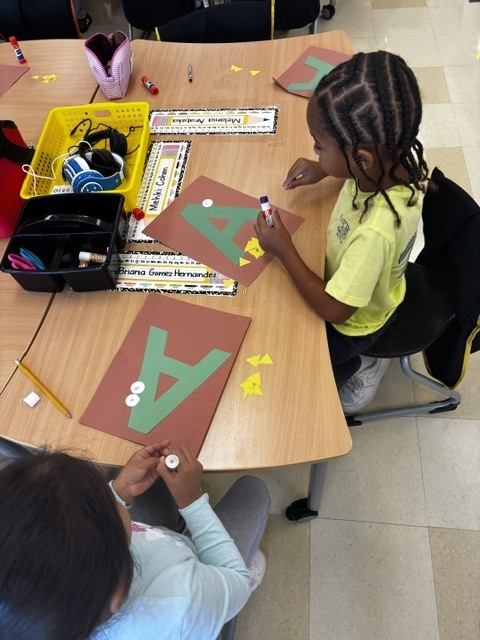 Kindergarten students make A for Alligator! 