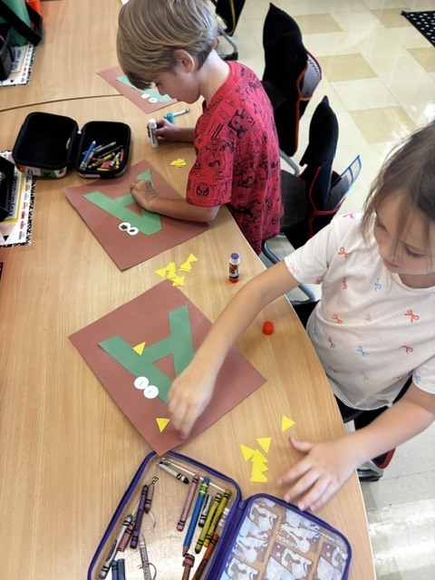 Kindergarten students make A for Alligator! 