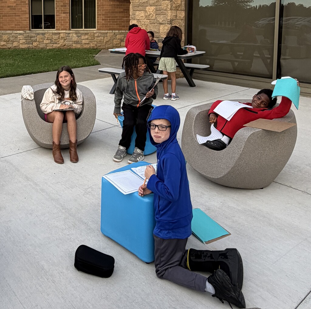 Students reading outdoors!