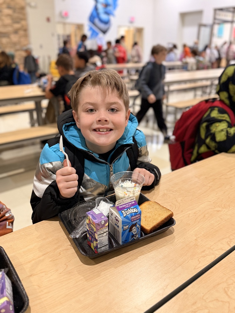 Student eating a yummy banana smoothie for breakfast! 