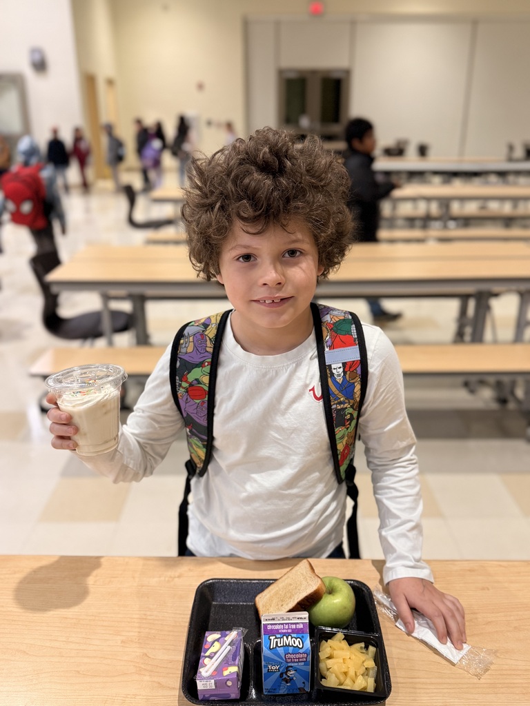 Student eating a yummy banana smoothie for breakfast! 