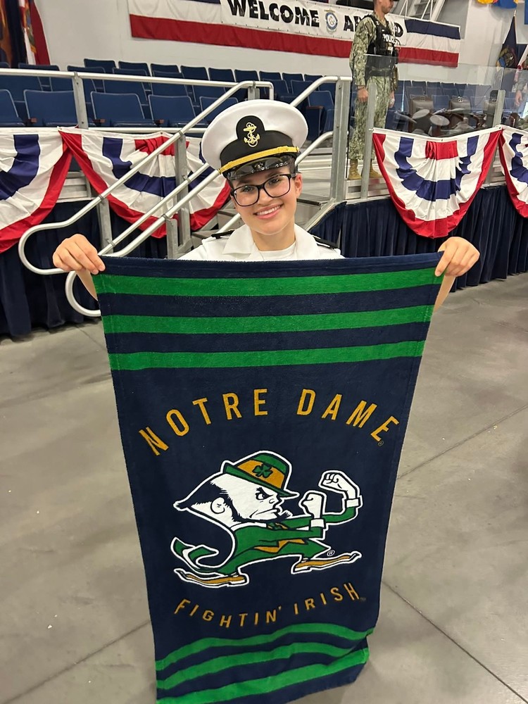 Marie Weiser hold Notre Dame Flag