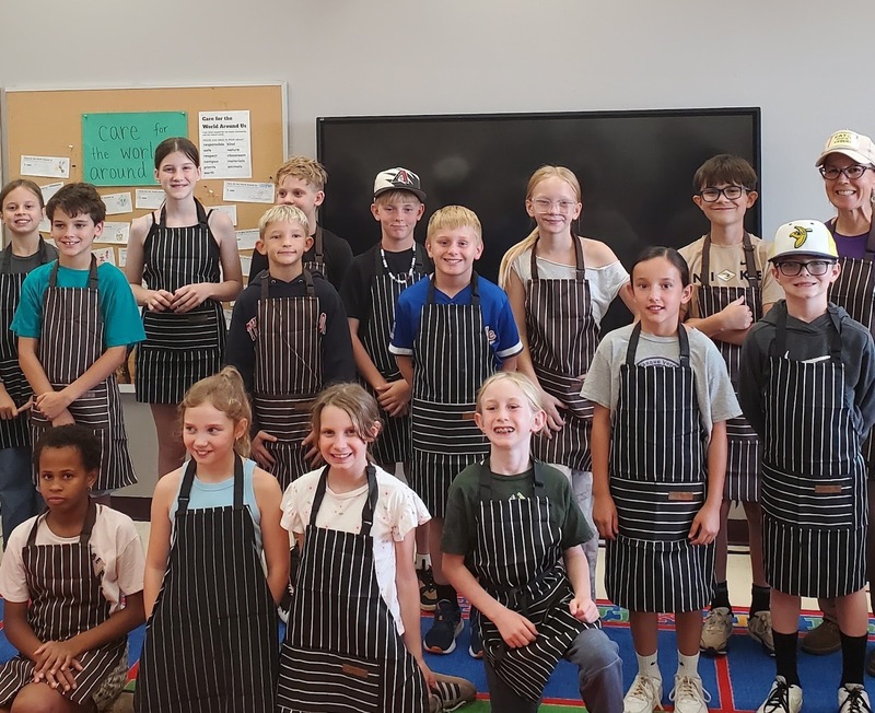 students in aprons