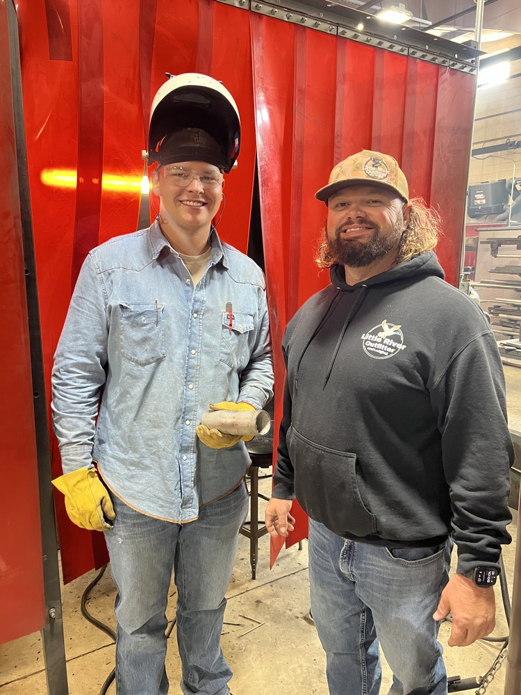 Caden and his welding teacher