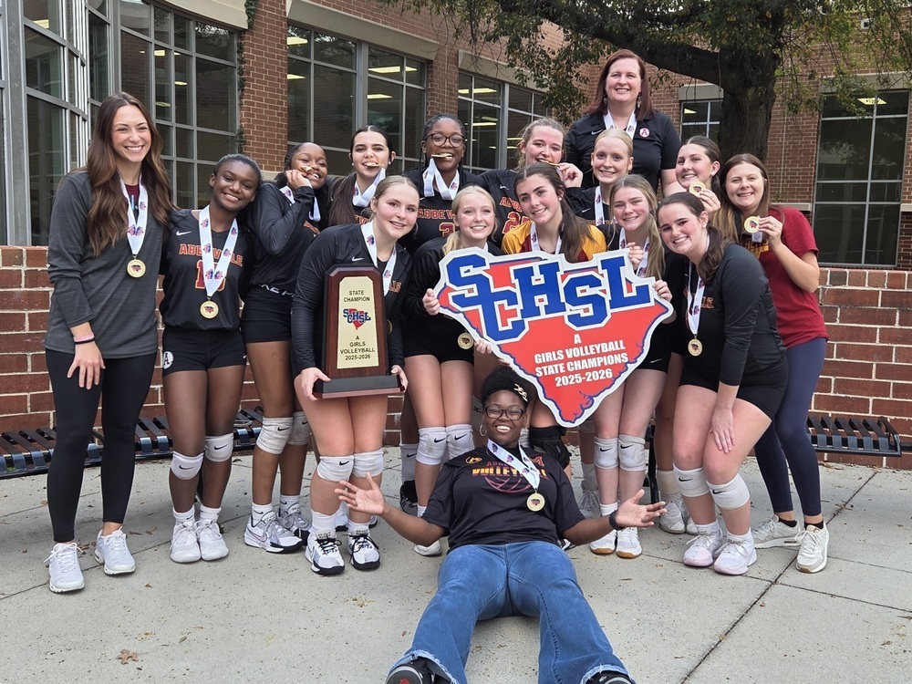 The Abbeville High School Volleyball State Champions holding their trophy