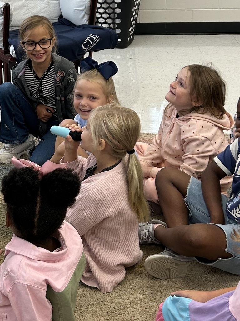 students participating in vocabulary practice with karaoke machine