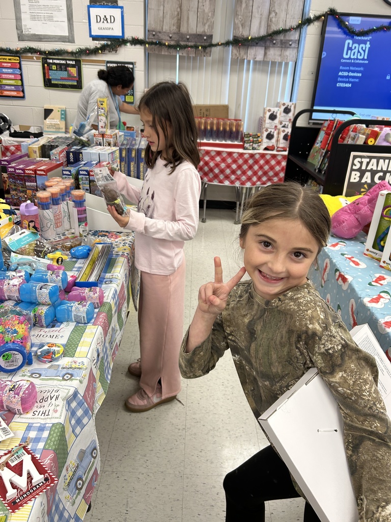 students shopping at the christmas store