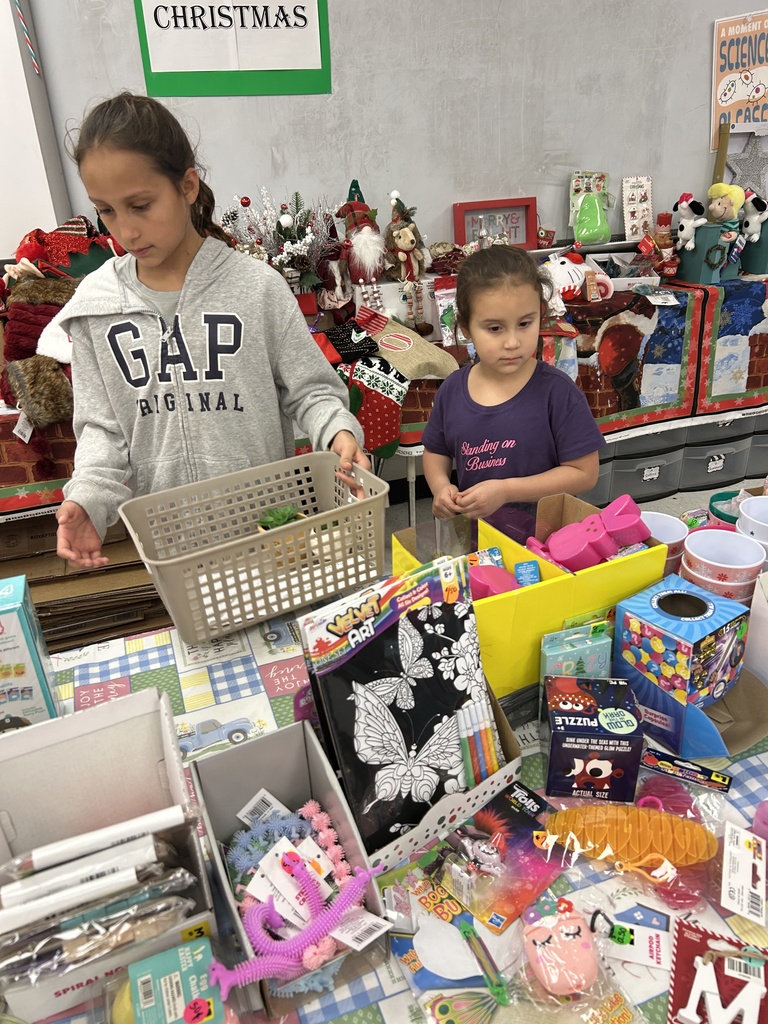 students shopping at the christmas store