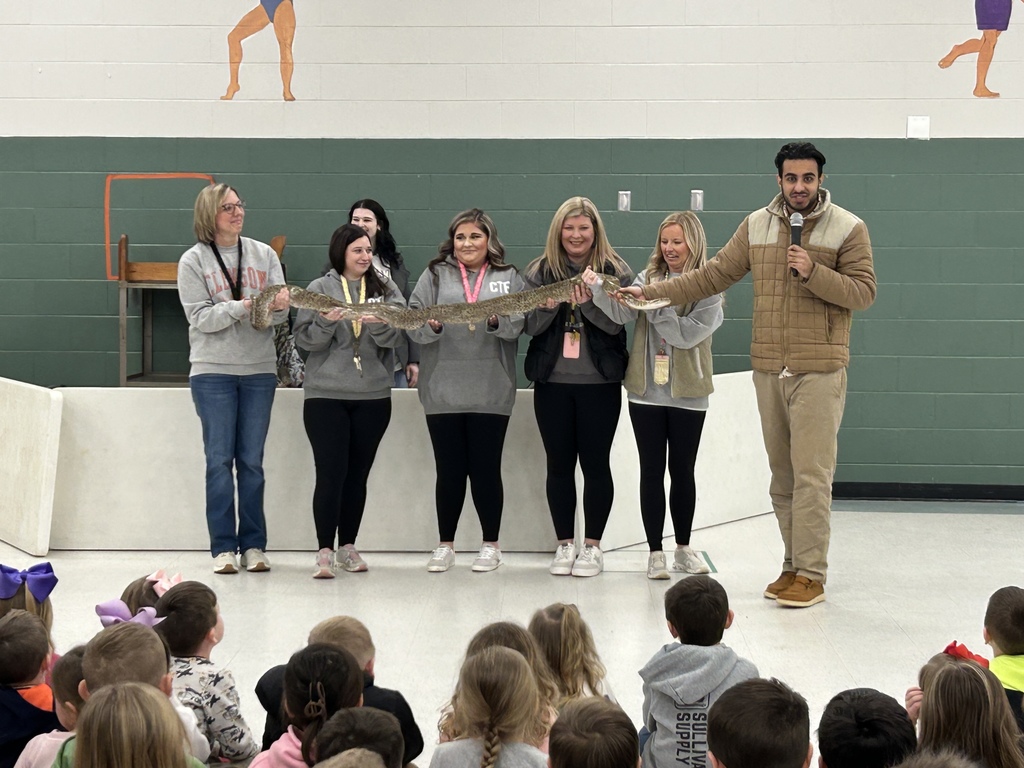 teachers holding a python