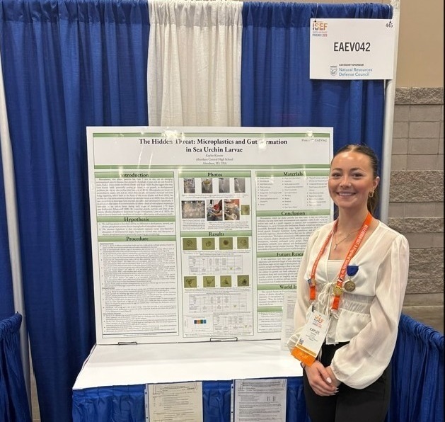 Kaylee Kiesow with her poster