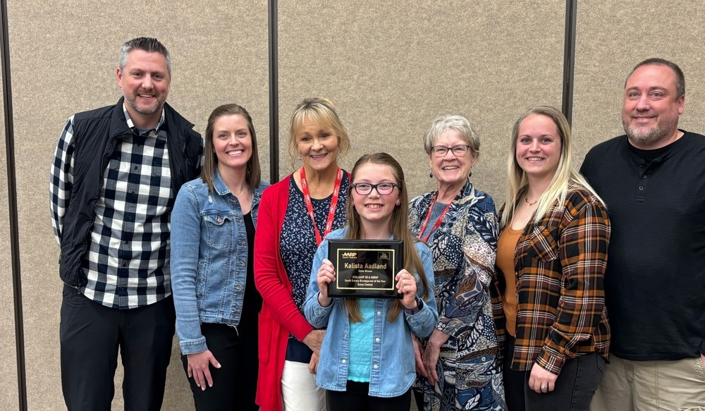 Kalista Aadland with her family, Gayle Bortnem, and contest chair