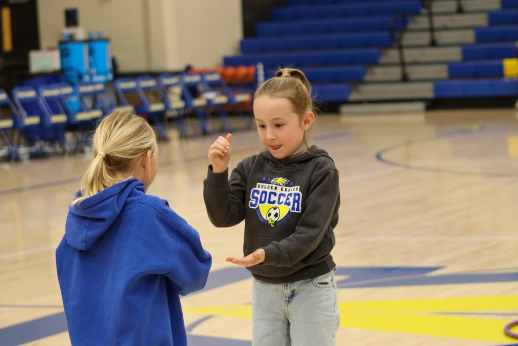 MME students playing games at halftime of the basketball game