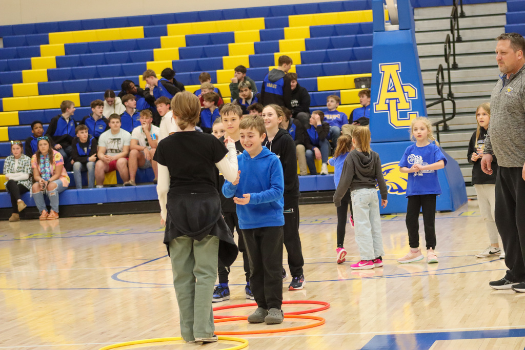 MME students playing games at halftime of the basketball game