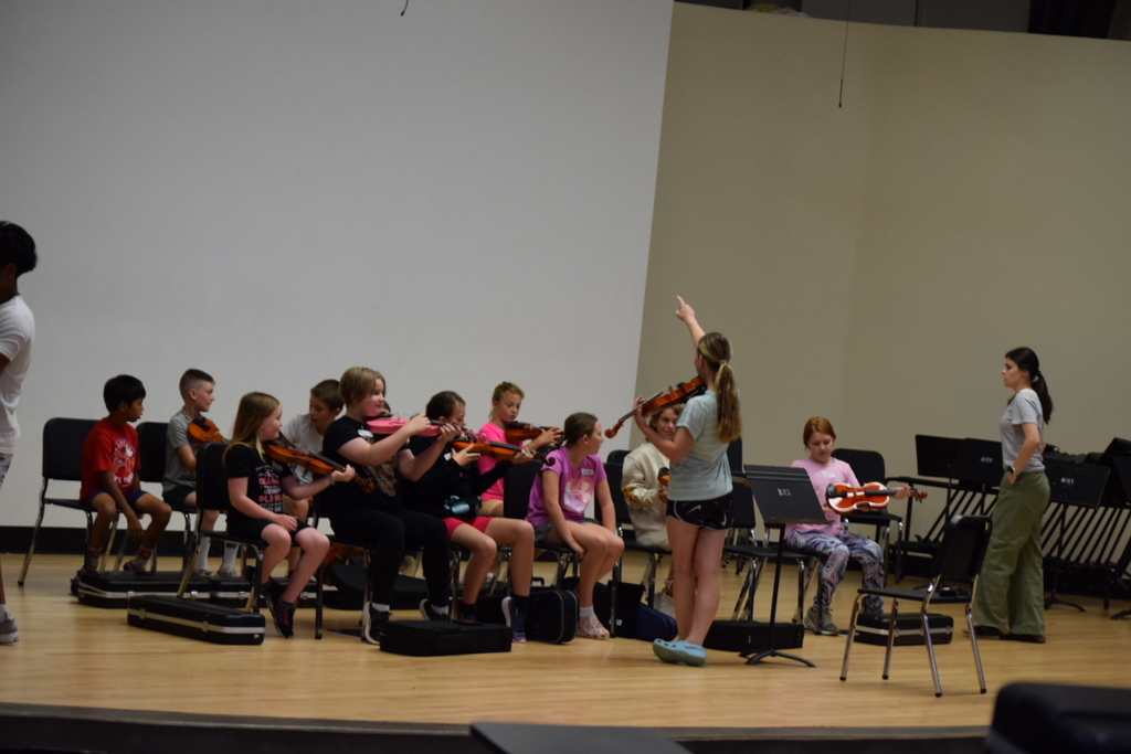 Students and teacher at orchestra camp