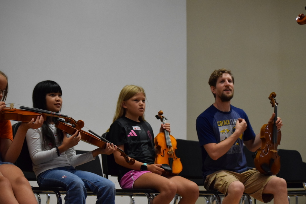 Students and teacher at orchestra camp