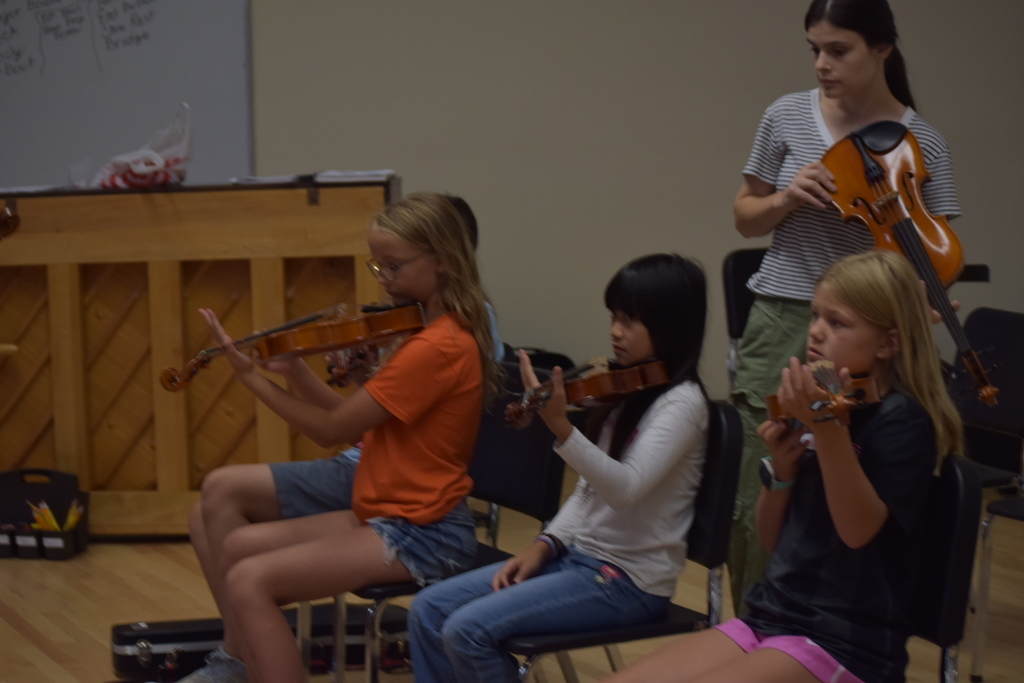 Students and teacher at orchestra camp