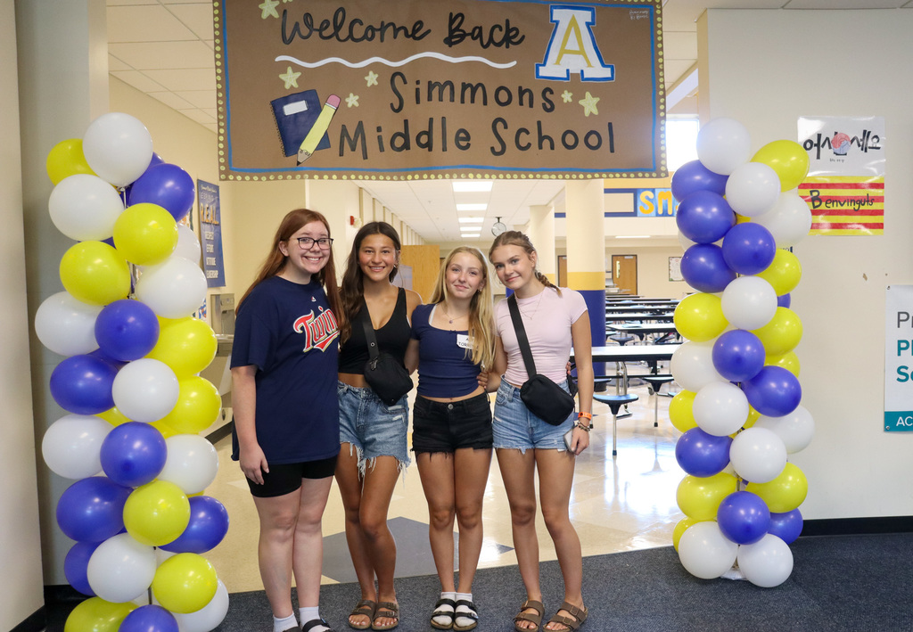 Students under the Welcome back photo area at SMS open house