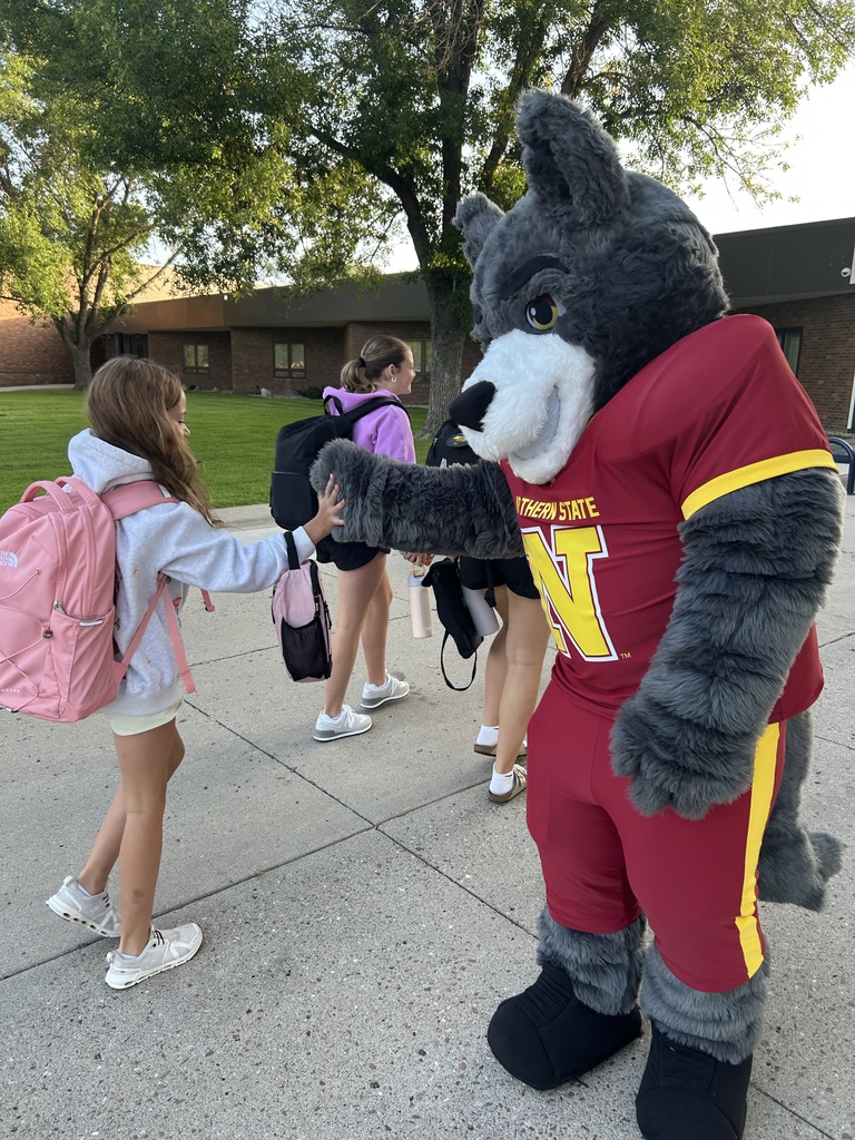 Thunder high fiving a Holgate student