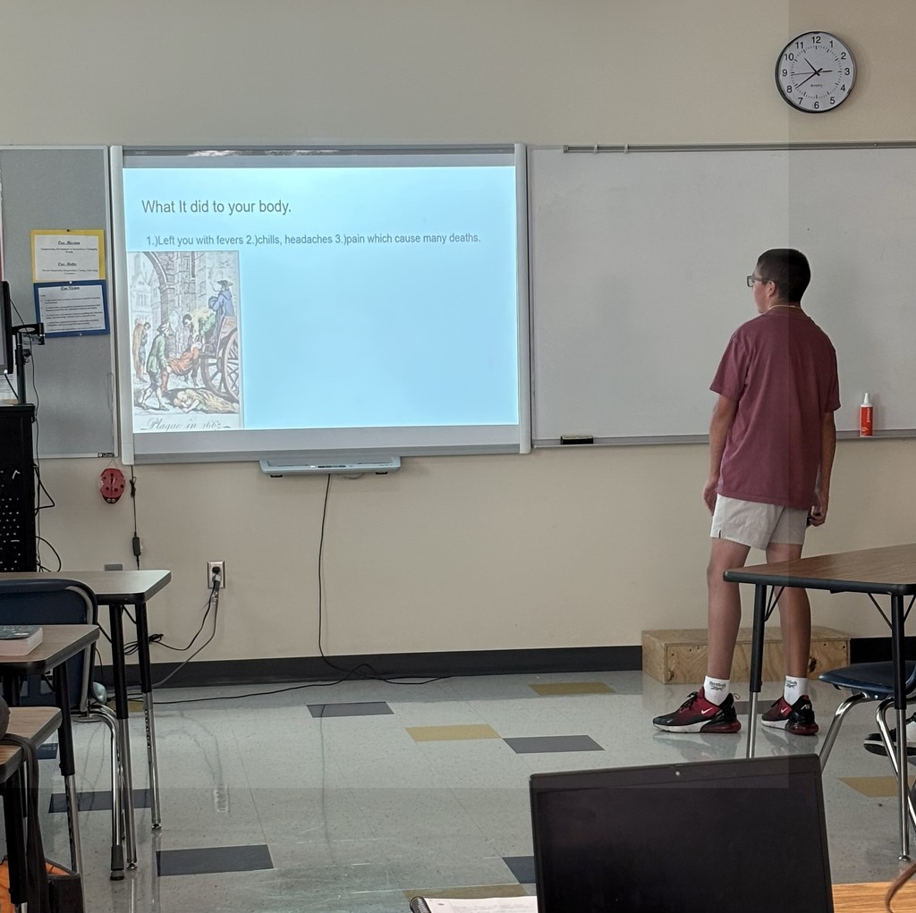 Health First AID student at ATEC giving a presentation on epidemics.