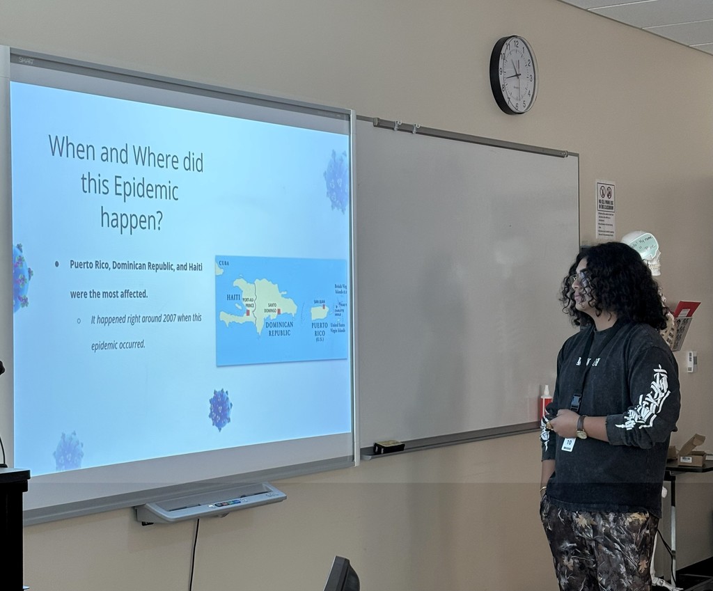 Health First AID student at ATEC giving a presentation on epidemics.