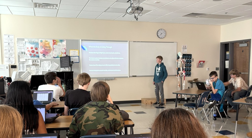 Health First AID student at ATEC giving a presentation on epidemics.