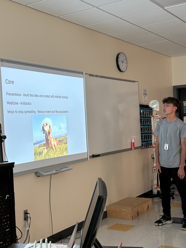 Health First AID student at ATEC giving a presentation on epidemics.