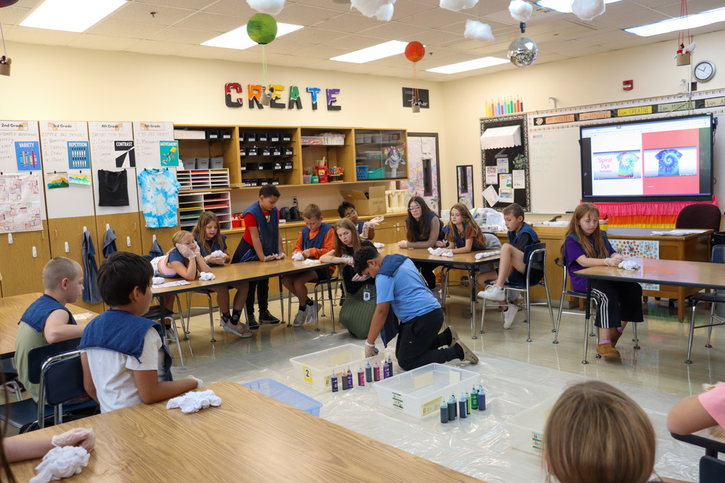 O.M. Tiffany students tie-dyeing T-shirts