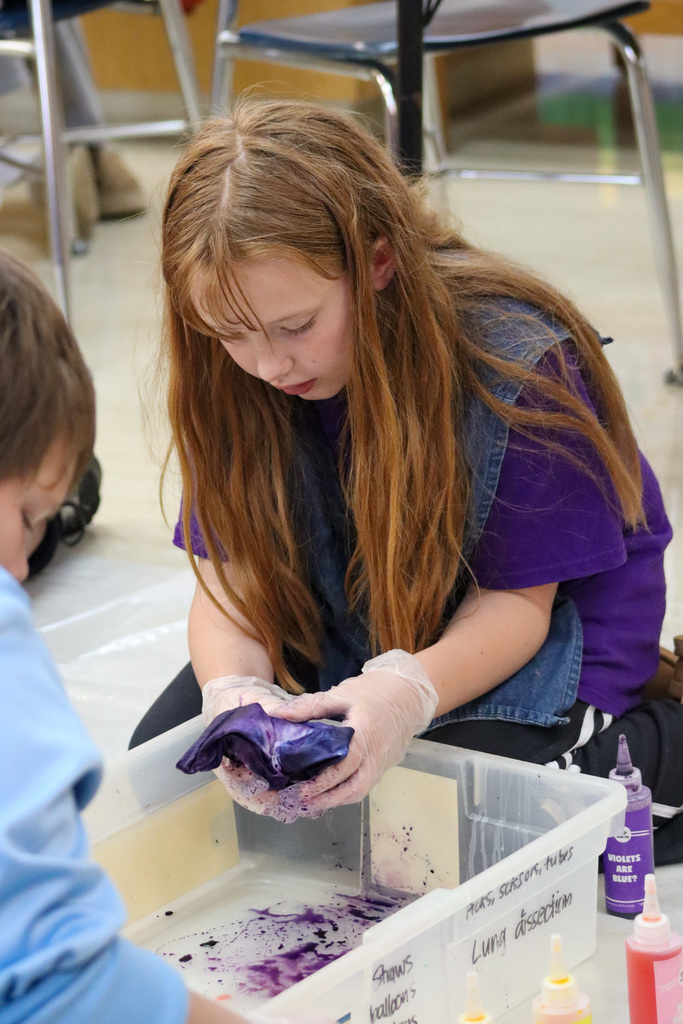 O.M. Tiffany students tie-dyeing T-shirts