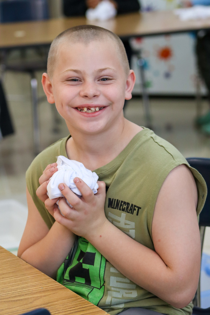 O.M. Tiffany students tie-dyeing T-shirts