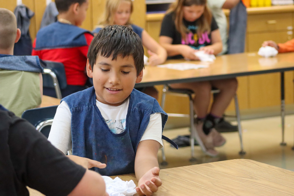O.M. Tiffany students tie-dyeing T-shirts