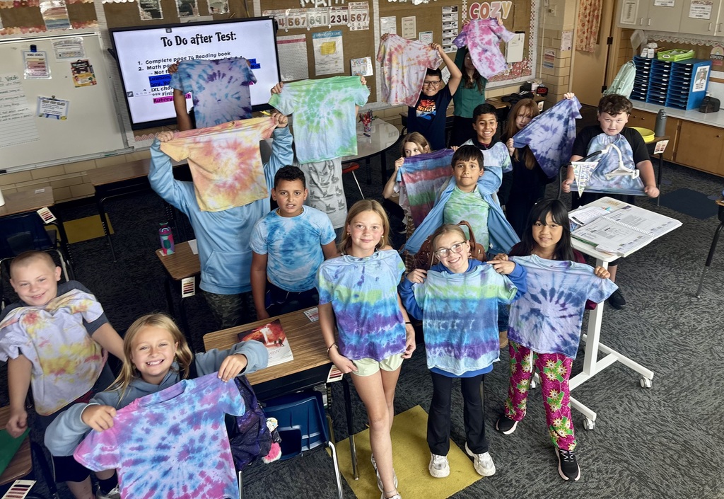 O.M. Tiffany students with their wearable art projects