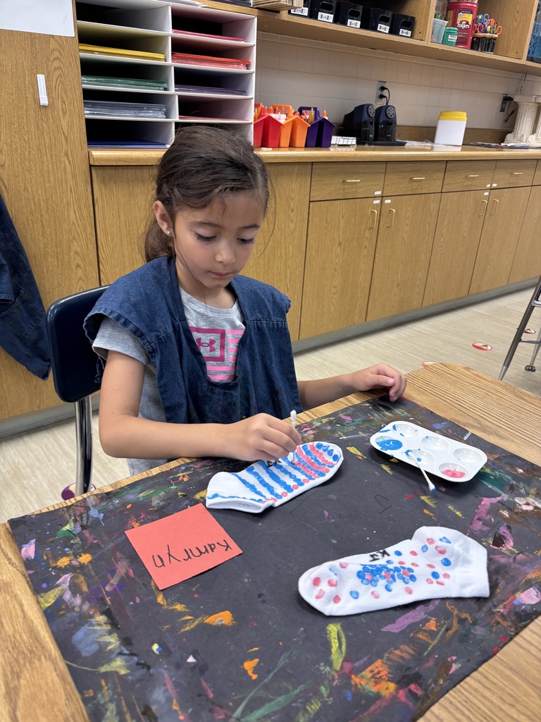O.M. Tiffany student working on wearable art projects